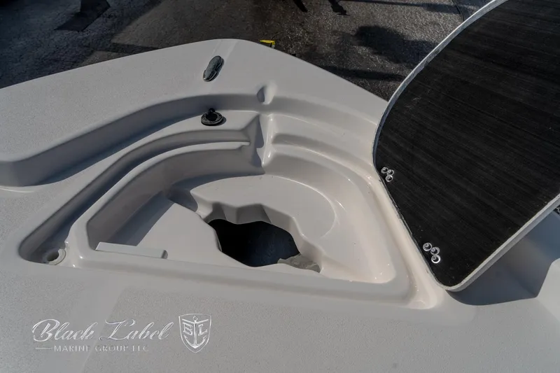 Slide: The Image of 2024 Sea Fox Seafox 251 Bay boat deck detail with storage compartment. - 12