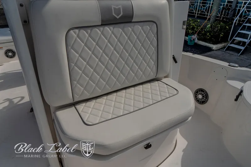Slide: The Image of 2024 Sea Fox Seafox 251 Bay boat seat with quilted upholstery, Black Label Marine Group logo. - 18