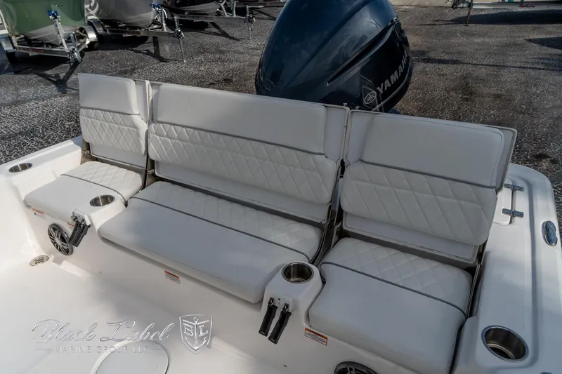 Slide: The Image of 2024 Sea Fox Seafox 251 Bay boat seating with Yamaha engine in background. - 24