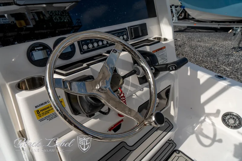 Slide: The Image of 2024 Sea Fox Seafox 251 Bay boat steering console with controls and gauges. - 27