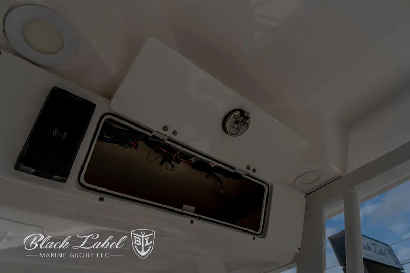 Slide: The Image of 2024 Sea Fox Seafox 251 Bay interior storage compartment with Black Label Marine Group logo. - 32