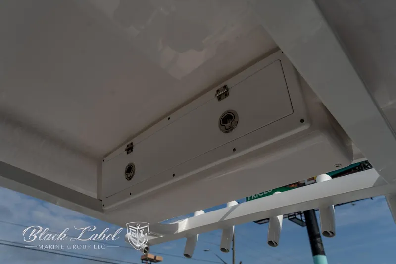 Slide: The Image of 2024 Sea Fox Seafox 251 Bay boat storage compartment, Black Label Marine Group branding. - 33