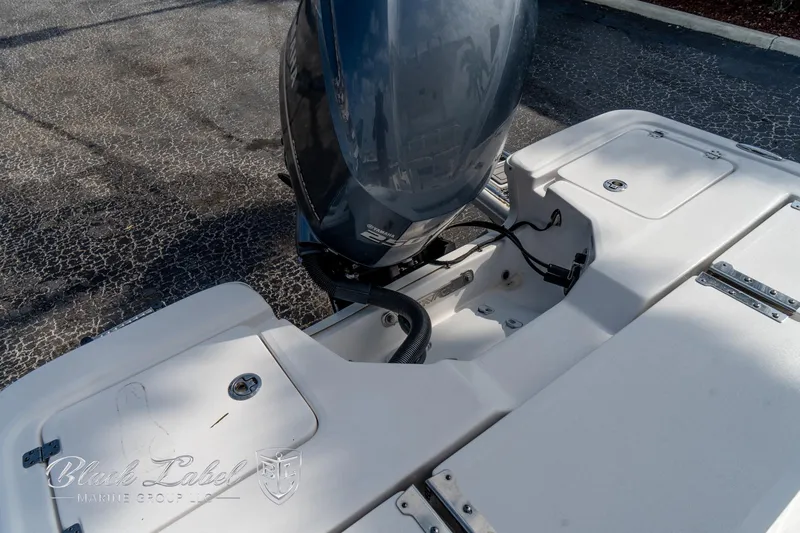 Slide: The Image of 2024 Sea Fox Seafox 251 Bay boat engine and deck detail. - 36