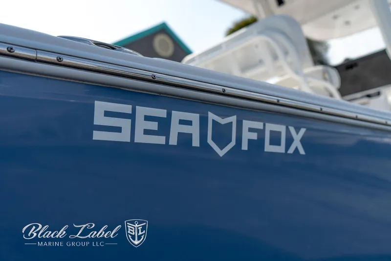 Slide: The Image of 2024 Sea Fox Seafox 251 Bay boat with logo, showcased by Black Label Marine Group. - 4