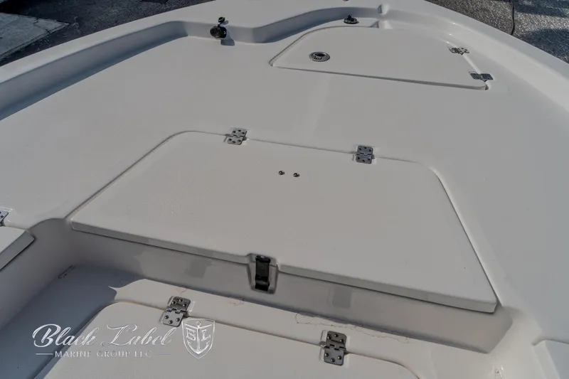 Slide: The Image of 2024 Sea Fox Seafox 251 Bay boat deck with storage compartments. - 9