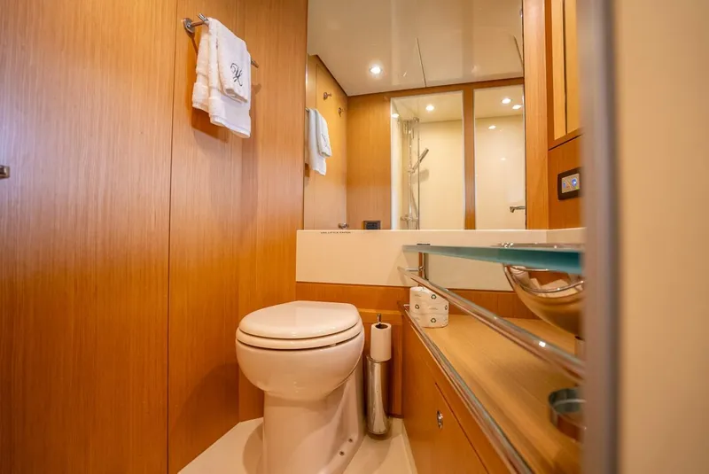 Slide: The Image of Luxurious bathroom in 2012 Riva 56 Sportriva yacht with modern fixtures and wooden accents. - 14