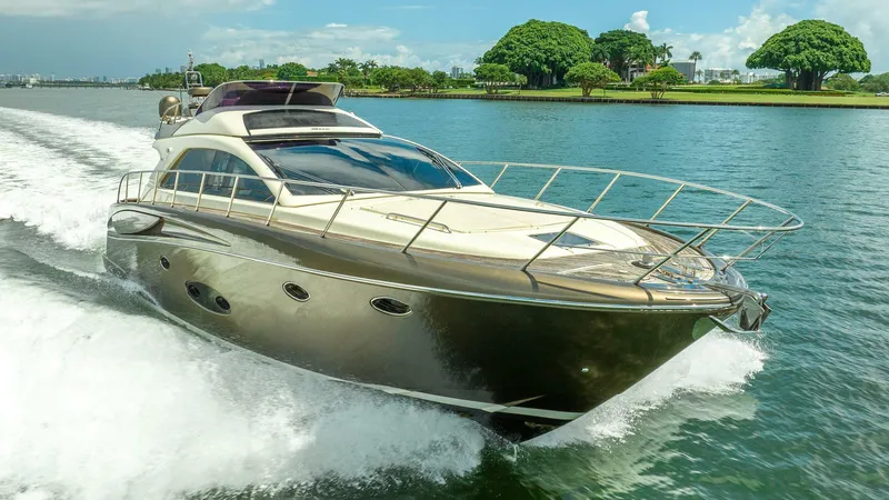 Slide: The Image of Luxurious 2012 Riva 56 Sportriva yacht cruising on a serene waterway. - 2