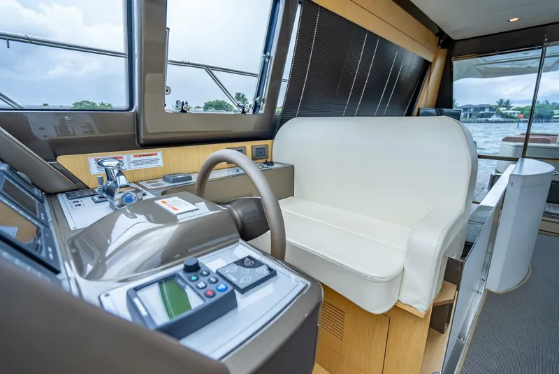 Slide: The Image of Interior helm of 2012 Riva 56 Sportriva yacht with modern controls and seating. - 24