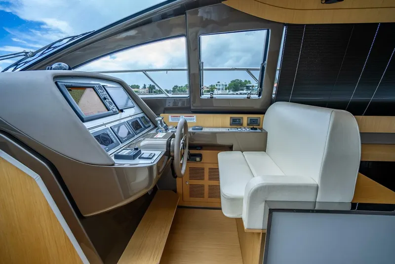 Slide: The Image of Interior cockpit of 2012 Riva 56 Sportriva yacht with modern controls and seating. - 25