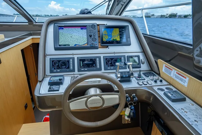 Slide: The Image of Cockpit of 2012 Riva 56 Sportriva yacht with navigation screens and controls. - 26