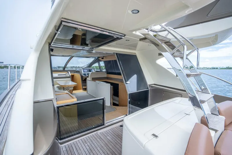 Slide: The Image of Luxurious 2012 Riva 56 Sportriva yacht interior with modern design and spacious seating. - 33