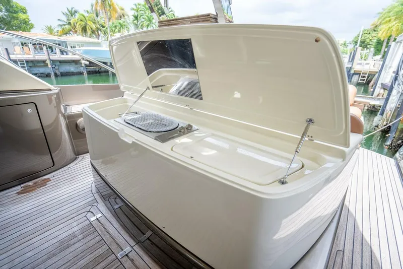 Slide: The Image of Open deck storage on 2012 Riva 56 Sportriva yacht, featuring sleek design and wood flooring. - 38