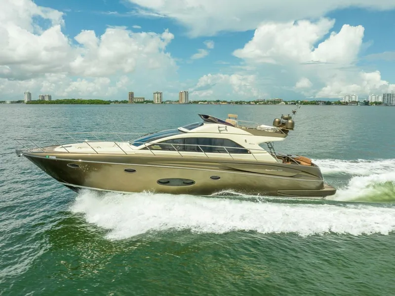 Slide: The Image of 2012 Riva 56 Sportriva yacht cruising on open water under a clear sky. - 4