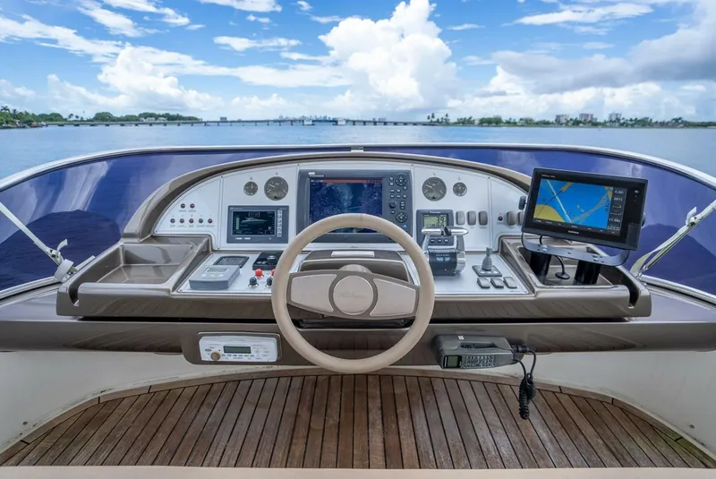Slide: The Image of Cockpit view of 2012 Riva 56 Sportriva yacht with navigation equipment and scenic ocean backdrop. - 42