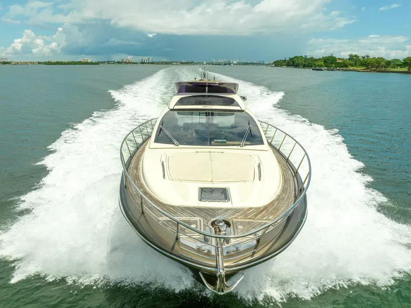 Slide: The Image of 2012 Riva 56 Sportriva yacht cruising on open water, leaving a wake behind. - 5
