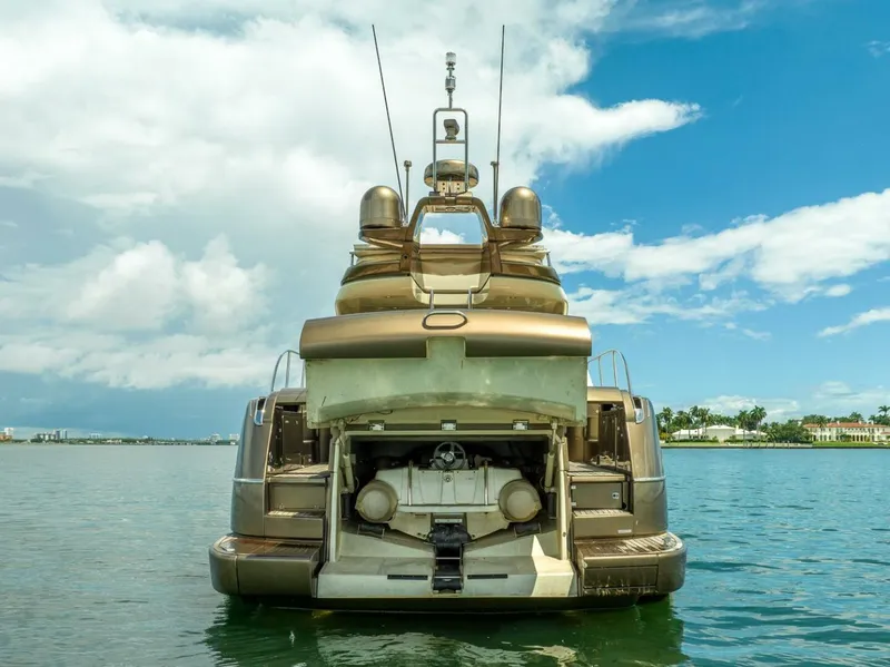Slide: The Image of 2012 Riva 56 Sportriva yacht on water, rear view under blue sky. - 6