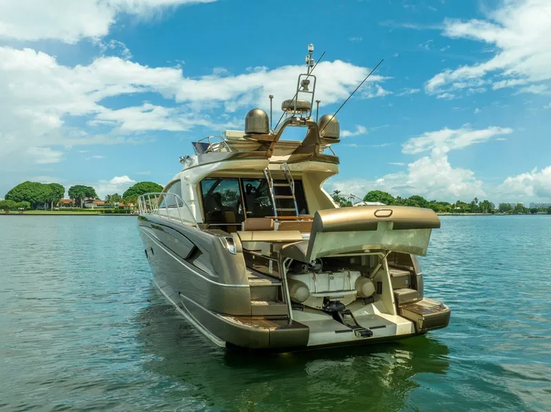 Slide: The Image of 2012 Riva 56 Sportriva luxury yacht on calm water under blue sky. - 7
