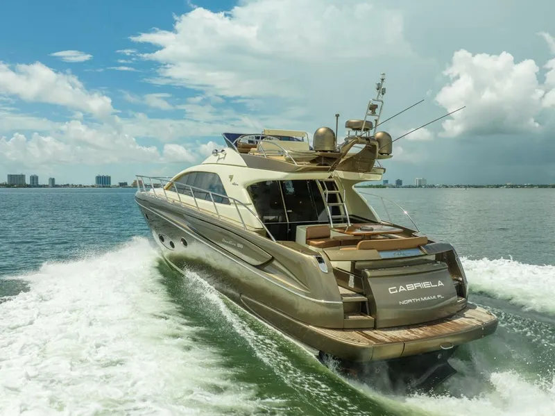 Slide: The Image of Luxurious 2012 Riva 56 Sportriva yacht cruising on open water. - 8