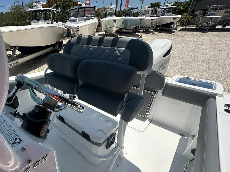 Slide: The Image of 2024 NauticStar 222 OS boat interior with dual seating and steering console. - 4