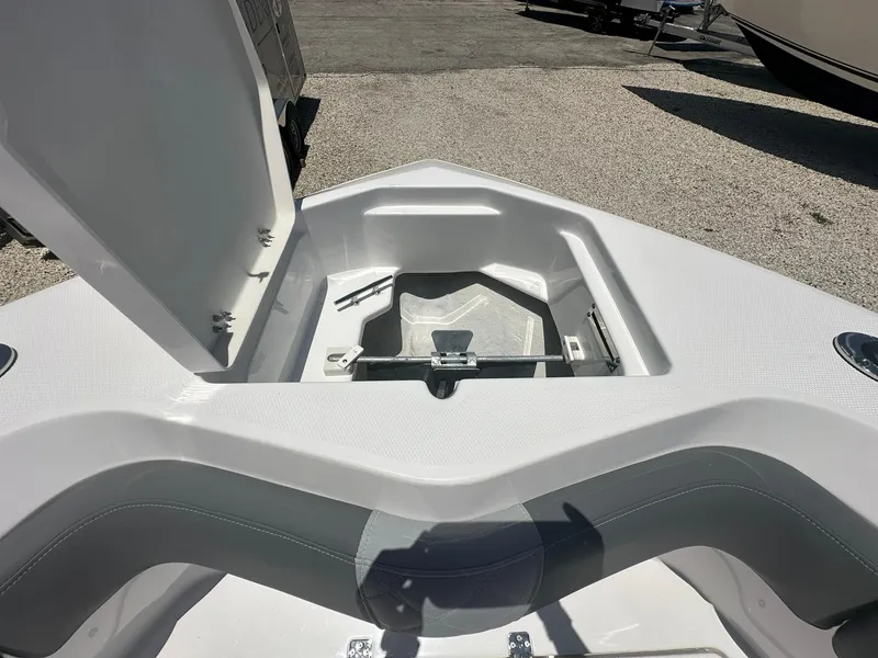Slide: The Image of 2024 NauticStar 222 OS boat bow storage compartment. - 7