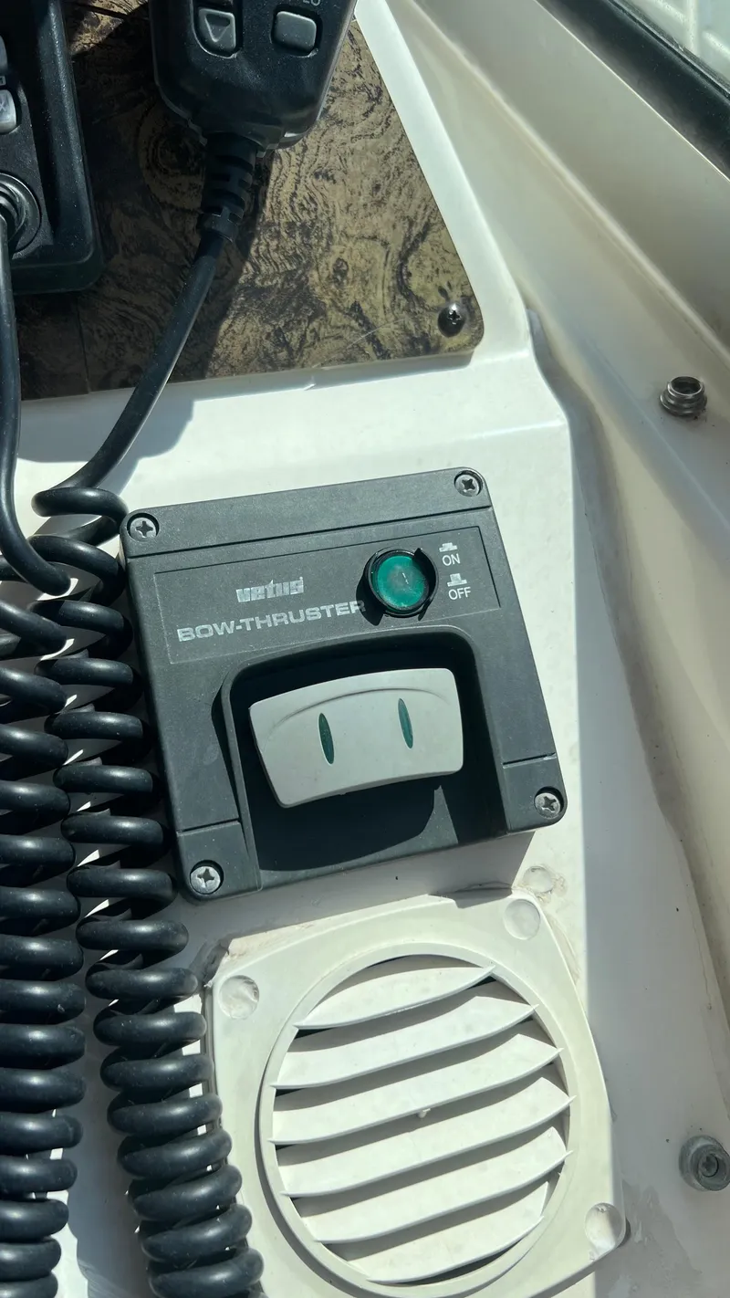 Slide: The Image of Sea Ray 400 1997 bow thruster control panel with on/off switch and vent. - 11