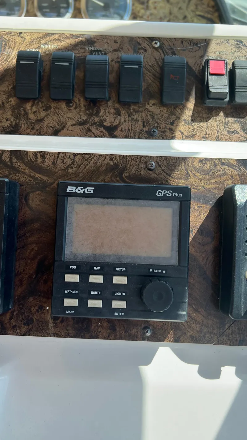 Slide: The Image of Control panel of a 1997 Sea Ray 400 boat with B&G GPS Plus system. - 13