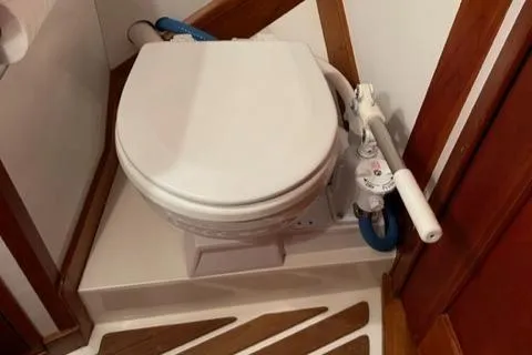 Slide: The Image of Hinckley Sou'wester 42 1987 marine toilet with manual pump in wooden interior. - 9