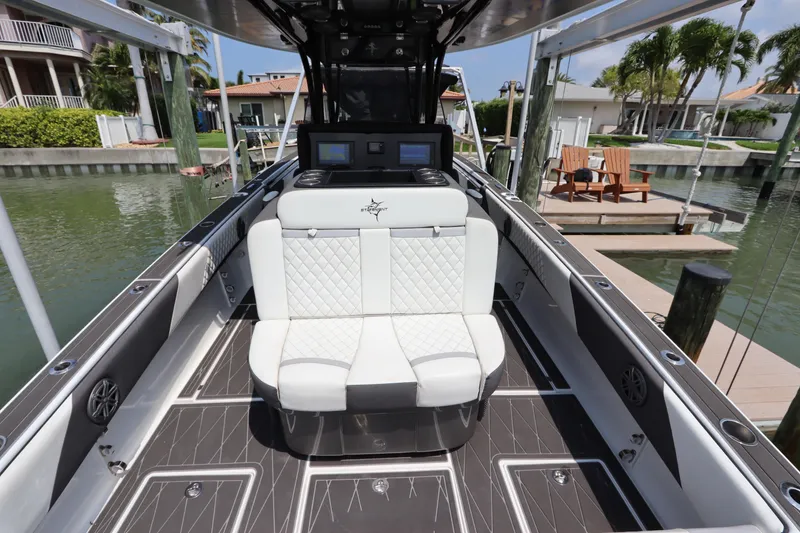 Slide: The Image of 2019 Statement 350 Open boat interior with white seating and modern dashboard. - 10