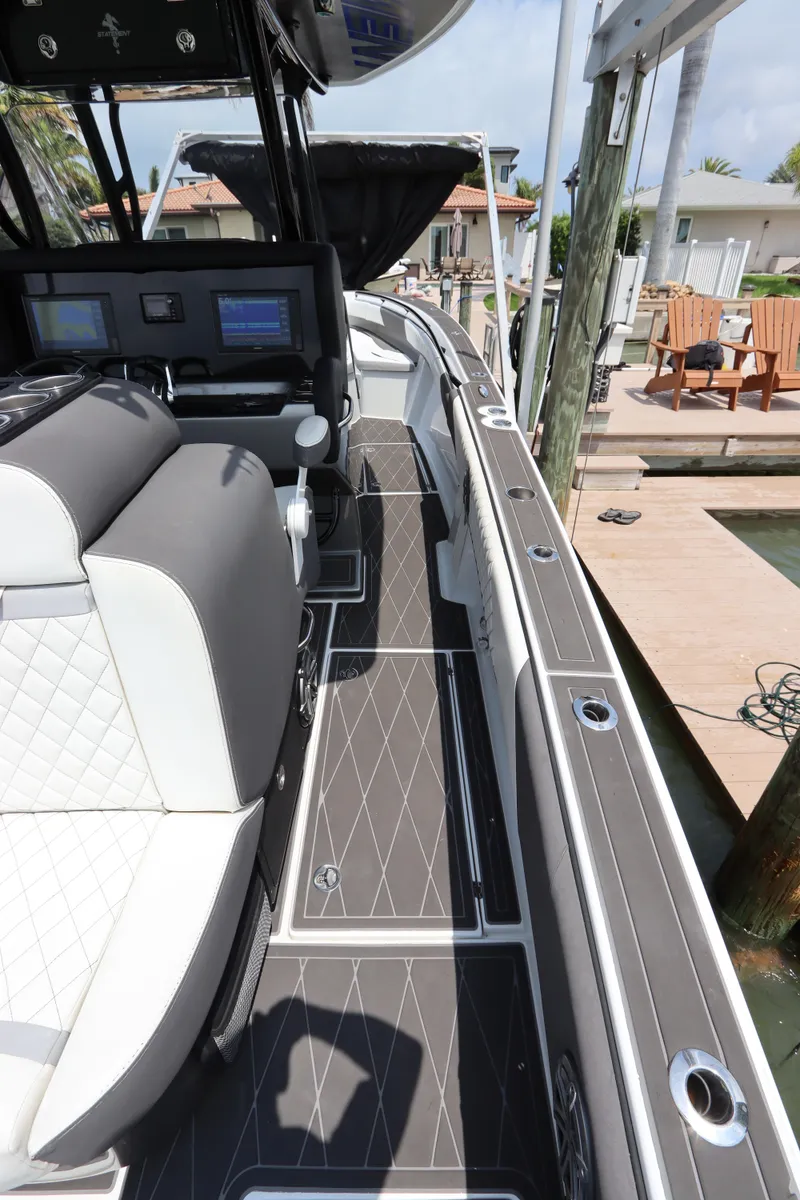 Slide: The Image of 2019 Statement 350 Open boat interior with modern seating and navigation equipment. - 18