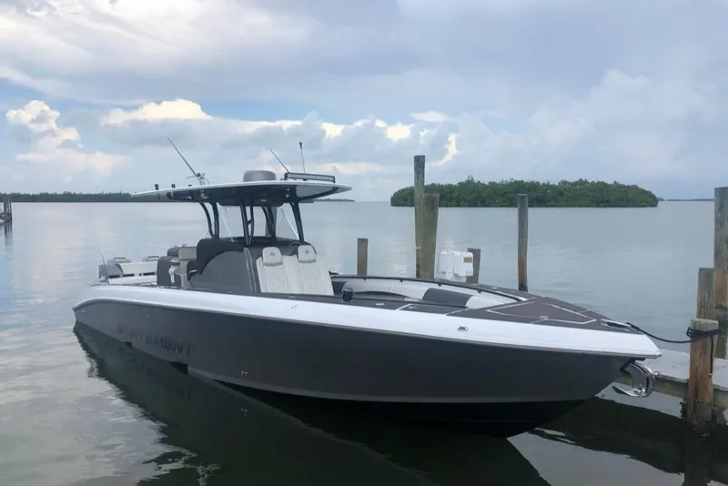The Image of 2019 Statement 350 Open boat docked by the water on a cloudy day. - 2
