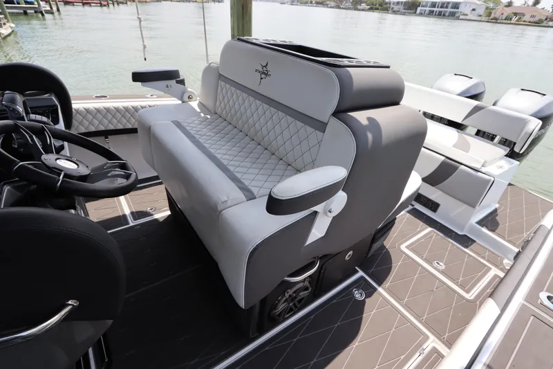 Slide: The Image of 2019 Statement 350 Open boat interior with luxurious seating and steering wheel. - 21