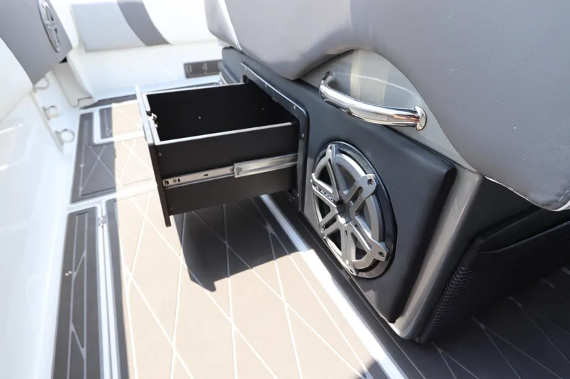 Slide: The Image of 2019 Statement 350 Open boat interior with open storage drawer and speaker. - 22