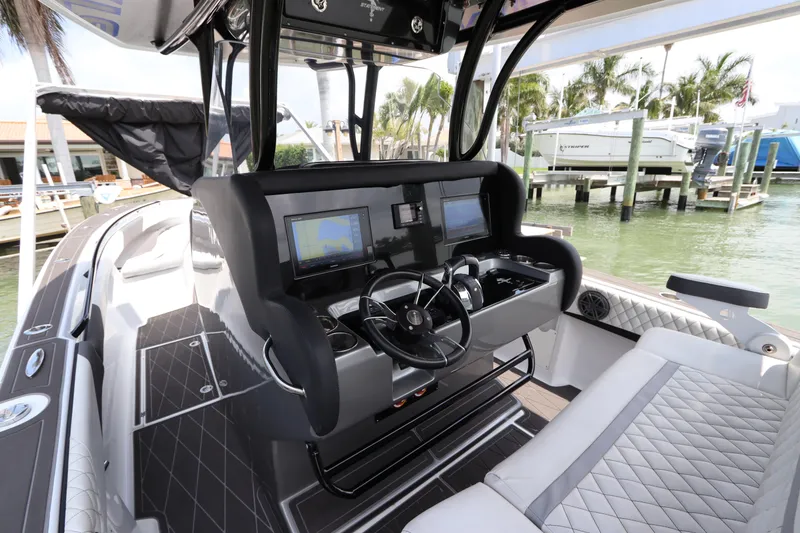 Slide: The Image of 2019 Statement 350 Open boat cockpit with advanced navigation systems and luxurious seating. - 23