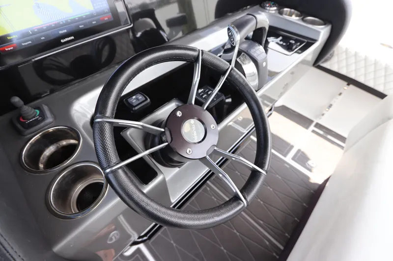 Slide: The Image of Steering wheel and dashboard of a 2019 Statement 350 Open boat. - 25