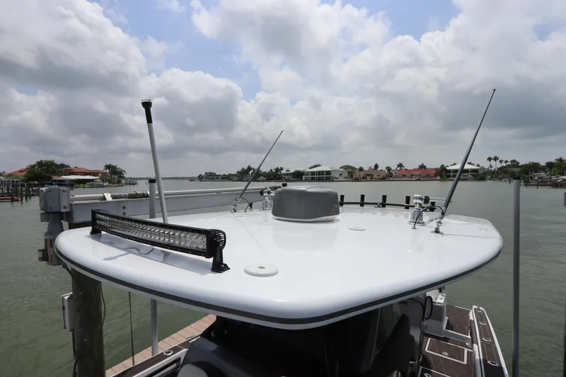 Slide: The Image of Statement 350 Open 2019 boat docked with a view of the water and cloudy sky. - 38