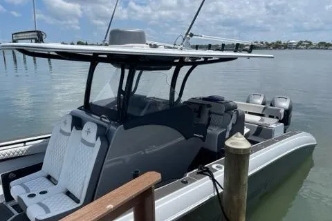 Slide: The Image of 2019 Statement 350 Open boat docked on calm water. - 4