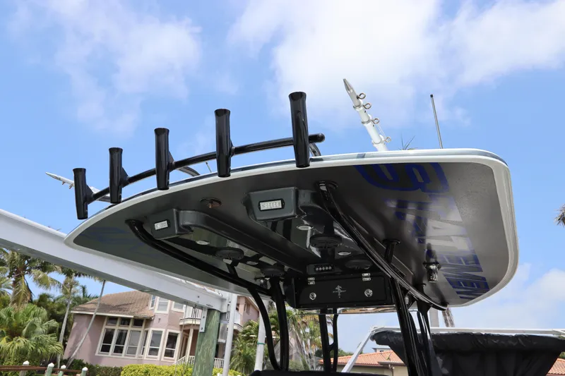 Slide: The Image of 2019 Statement 350 Open boat with rod holders and electronics under a blue sky. - 44