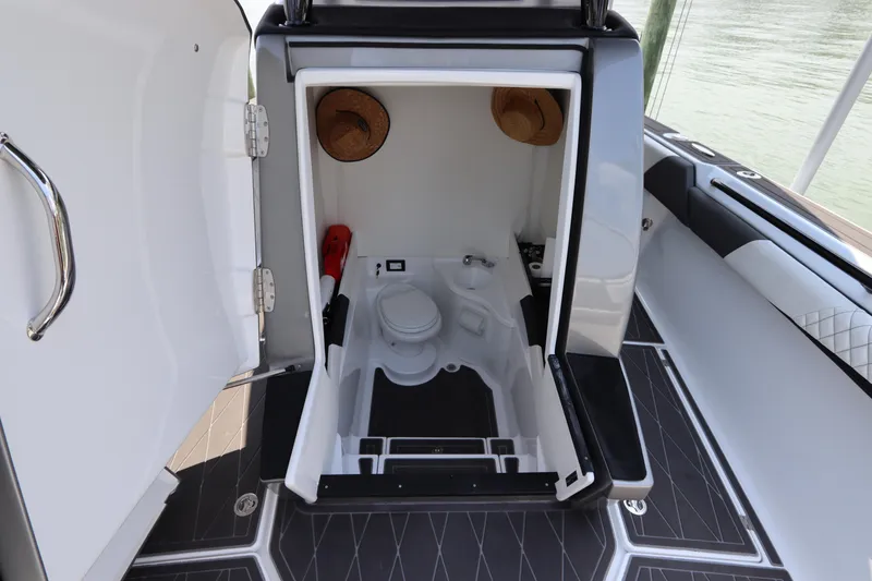Slide: The Image of Interior view of 2019 Statement 350 Open boat's compact bathroom. - 48