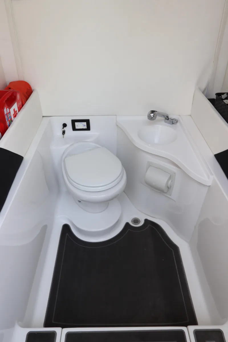 Slide: The Image of 2019 Statement 350 Open boat bathroom with toilet and sink. - 49