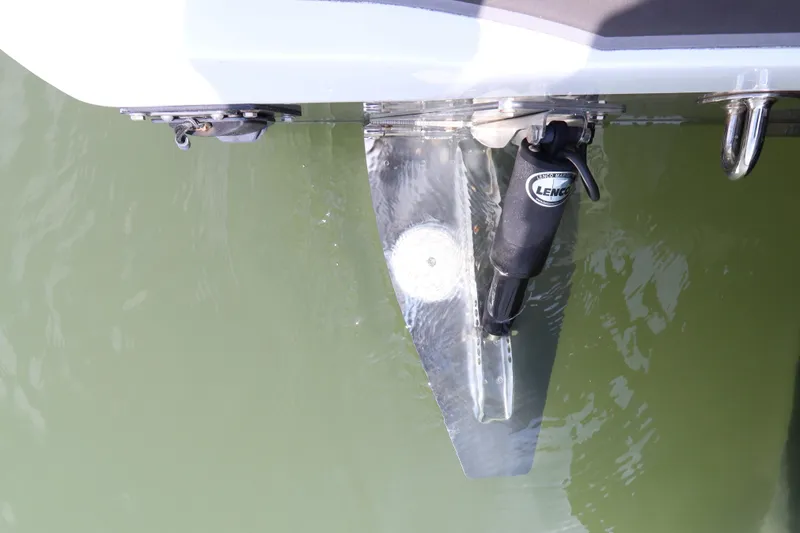 Slide: The Image of Trim tab of a 2019 Statement 350 Open boat in water. - 7