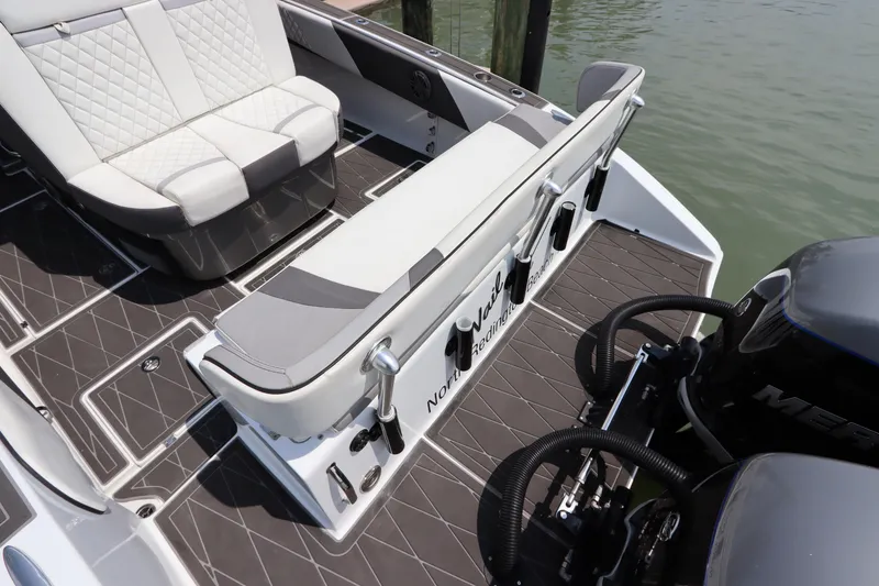Slide: The Image of 2019 Statement 350 Open boat interior with seating and Mercury engine. - 8