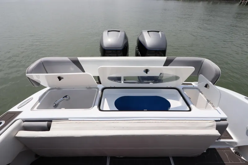 Slide: The Image of 2019 Statement 350 Open boat with dual outboard motors and open storage compartments. - 9