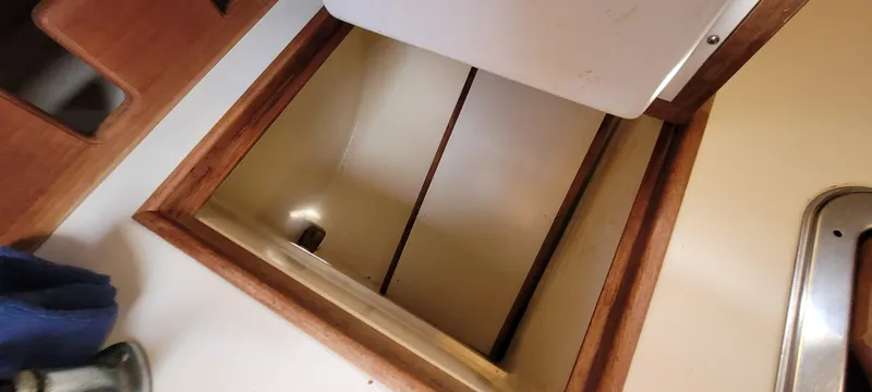 Slide: The Image of Interior storage compartment of 1986 Island Packet 27 Sloop sailboat. - 14
