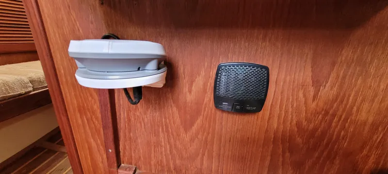 Slide: The Image of Wooden interior of 1986 Island Packet 27 Sloop with mounted devices. - 22