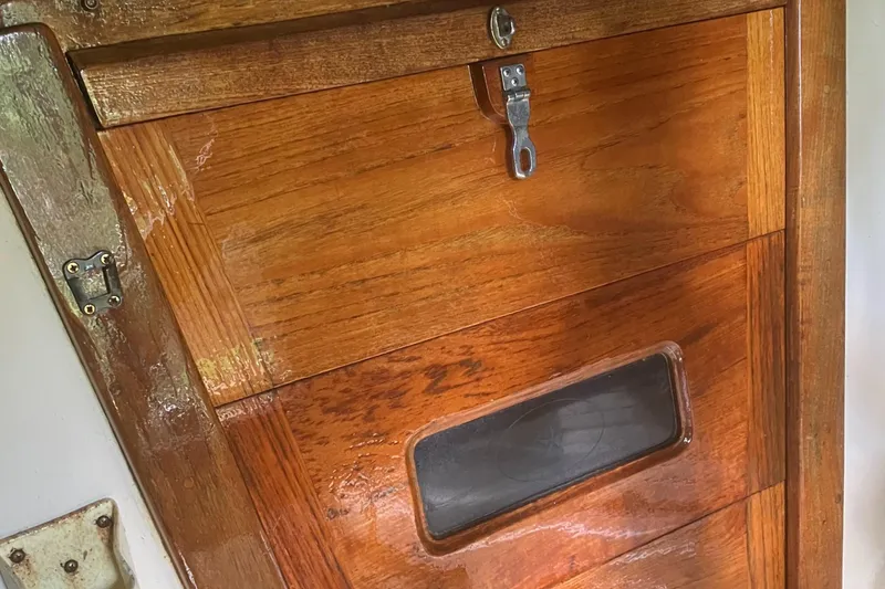 Slide: The Image of Wooden cabin door of a 1986 Island Packet 27 Sloop sailboat. - 24
