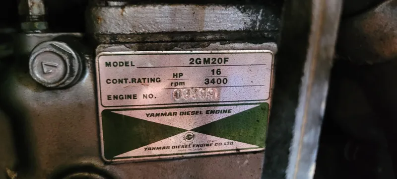 Slide: The Image of Yanmar diesel engine plate on 1986 Island Packet 27 Sloop, model 2GM20F, 16 HP, 3400 RPM. - 27