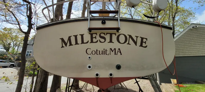 Slide: The Image of 1986 Island Packet 27 Sloop named "Milestone" in Cotuit, MA, displayed on land. - 33