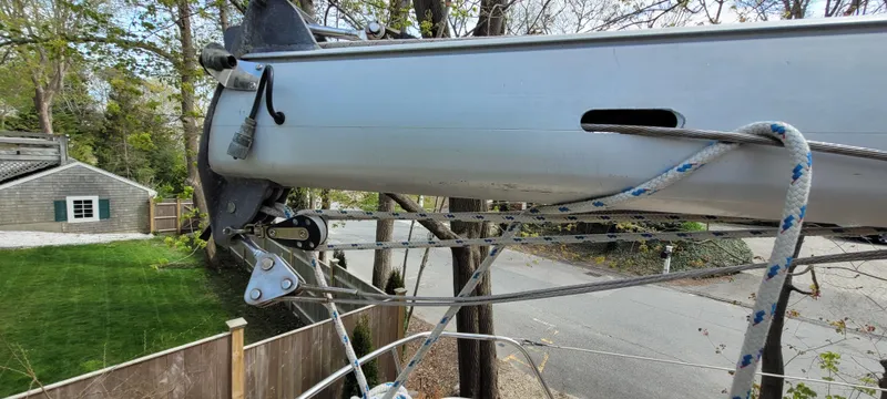 Slide: The Image of 1986 Island Packet 27 Sloop mast and rigging detail near residential area. - 34