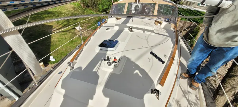 Slide: The Image of 1986 Island Packet 27 Sloop deck view with rigging and shadows. - 40