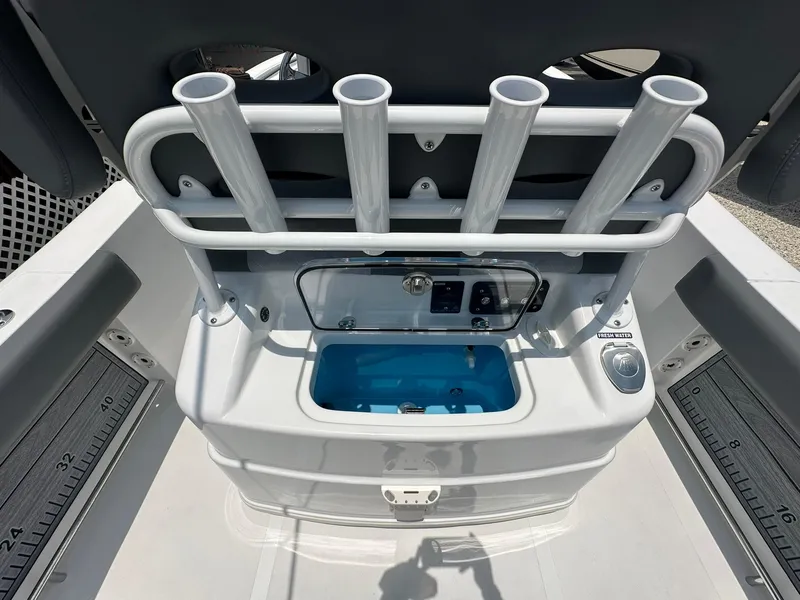 Slide: The Image of 2024 NauticStar 252 boat with rod holders and livewell. - 16